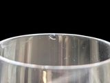 a close up of a glass of wine on a table