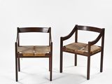 a pair of chairs with a wooden frame and leather seat