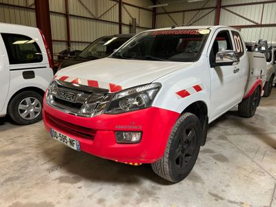 a picture of a white and red truck parked in a garage