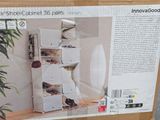 a cardboard box that has a bunch of shoes on it