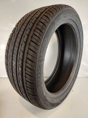 a close up of a tire on a white surface