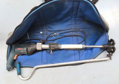 a blue bag with tools inside of it on the floor