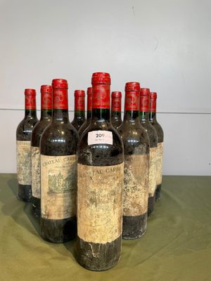 six bottles of wine are lined up on a table