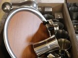 a box with a bunch of cups and pans inside of it