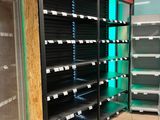 many empty shelves in a store that are full of items