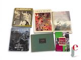a lot of books that are on the table