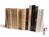 a lot of books that are sitting on a shelf