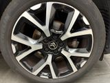 a close up view of a car ' s wheel and tire