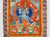 an orange and purple tapestry with a picture of a person on it