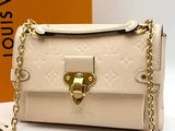 louis vuitton cross body bag in white with gold hardware