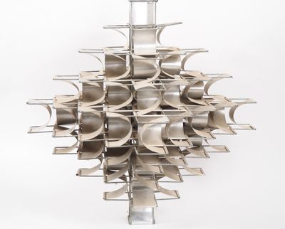 a large metal object that is hanging on a wall