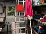 a ladder that is leaning against a wall in a room