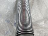 a close up of a metal pipe sitting on top of a table