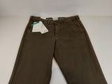 a pair of brown pants with a tag on the side