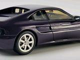 purple model of a sports car on a white surface with a white background