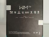 the box of the nintendo wii game system is sitting on a glass table