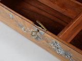 a small wooden box with a handle on it