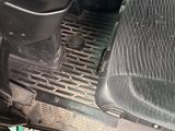 the inside of a car with a steering wheel and a steering control