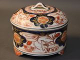 a small box with a lid that has flowers on it