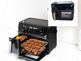 an image of a black air fryer oven with food in it
