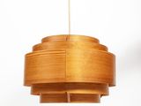 an image of a wooden light fixture hanging from a ceiling