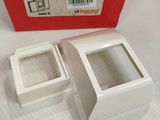 a white box with a red lid and a white box with a red lid
