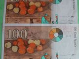 two bills with a picture of a man on them