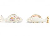 pair of porcelain fish figurines with floral decoration on body
