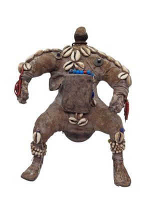 a statue of a man riding a horse made of clay