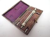 a small metal object inside of a purple case