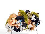 several stuffed animals sitting on a chair together