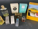 many different types of perfumes on the table