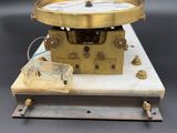 an image of a clock that is sitting on a table