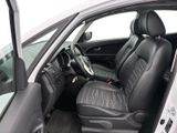 the interior of a white car with black leather seats and a steering wheel