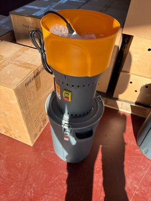 a yellow bucket sitting on top of a gray bucket