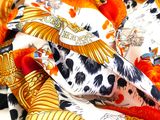 a lot of different types of scarves on a table