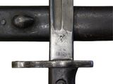 a close up of a knife on a metal pole