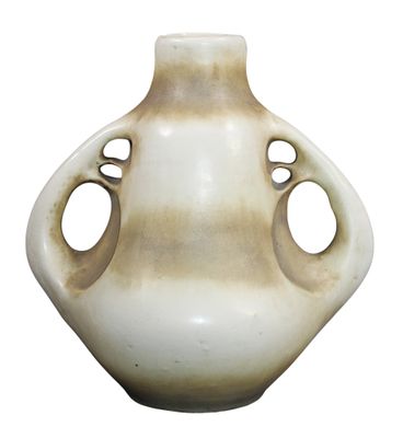 a white vase with holes in it on a white background