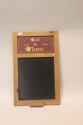 a chalk board on the wall that says cafe de flore