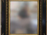 un cadre photo noir et doré avec une bordure dorée
