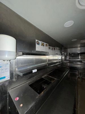 an image of a commercial kitchen with stainless steel appliances