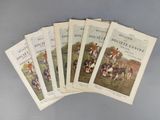 six livres posés sur une table, avec une photo représentant un groupe de personnes à cheval