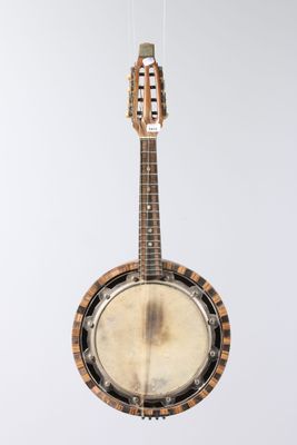 a close up of a banjo hanging from a string