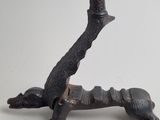 a statue of a dog with a sword on it ' s back
