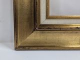 an image of a gold frame with a white background