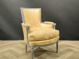 an image of a yellow chair sitting on top of a hard wood floor