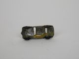 a toy car that is sitting on a white surface