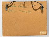 an old piece of cardboard with writing on it and a pair of scissors on it