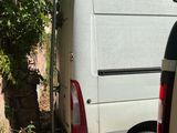 a van that is parked next to a rock wall