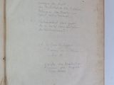 an open book with a handwritten poem on it sitting on top of a table